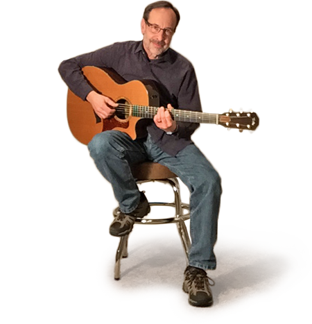 Fred Miller with guitar on stool